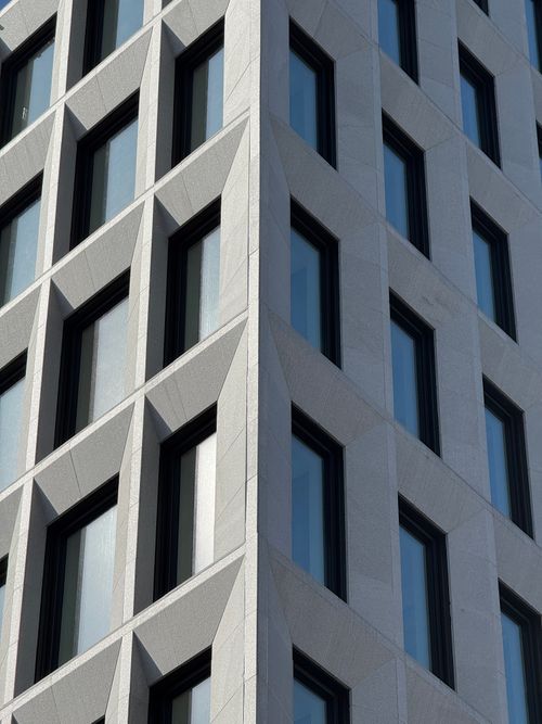 Free Close-up of a geometric building facade in Oslo, showcasing modern architecture. Stock Photo