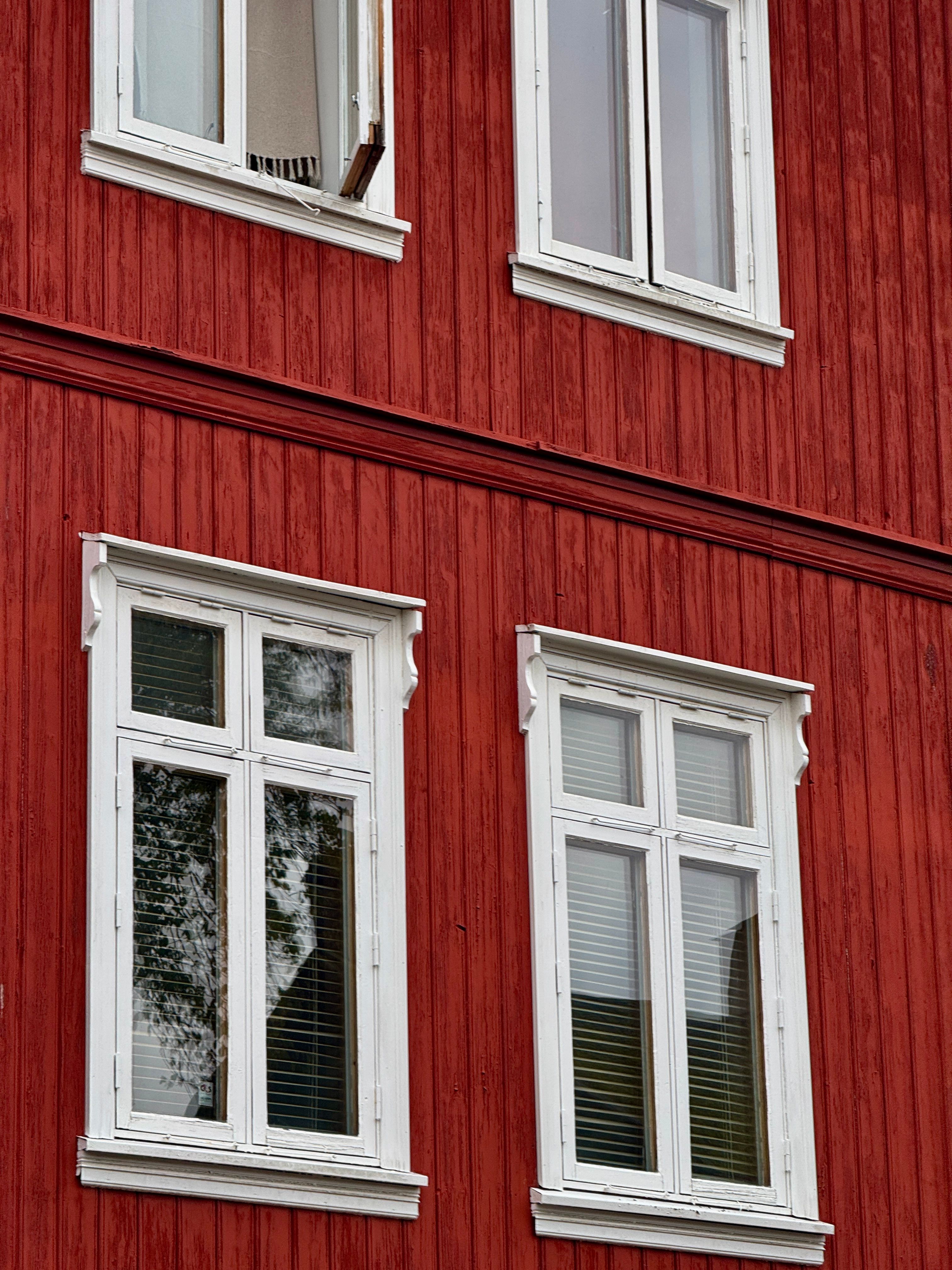 Charming Red Wooden House with Flowered Window · Free Stock Photo