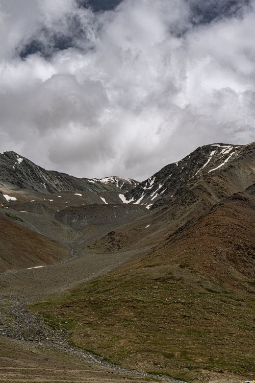 Free A breathtaking view of mountains and clouds in Langza, Himachal Pradesh, India. Stock Photo