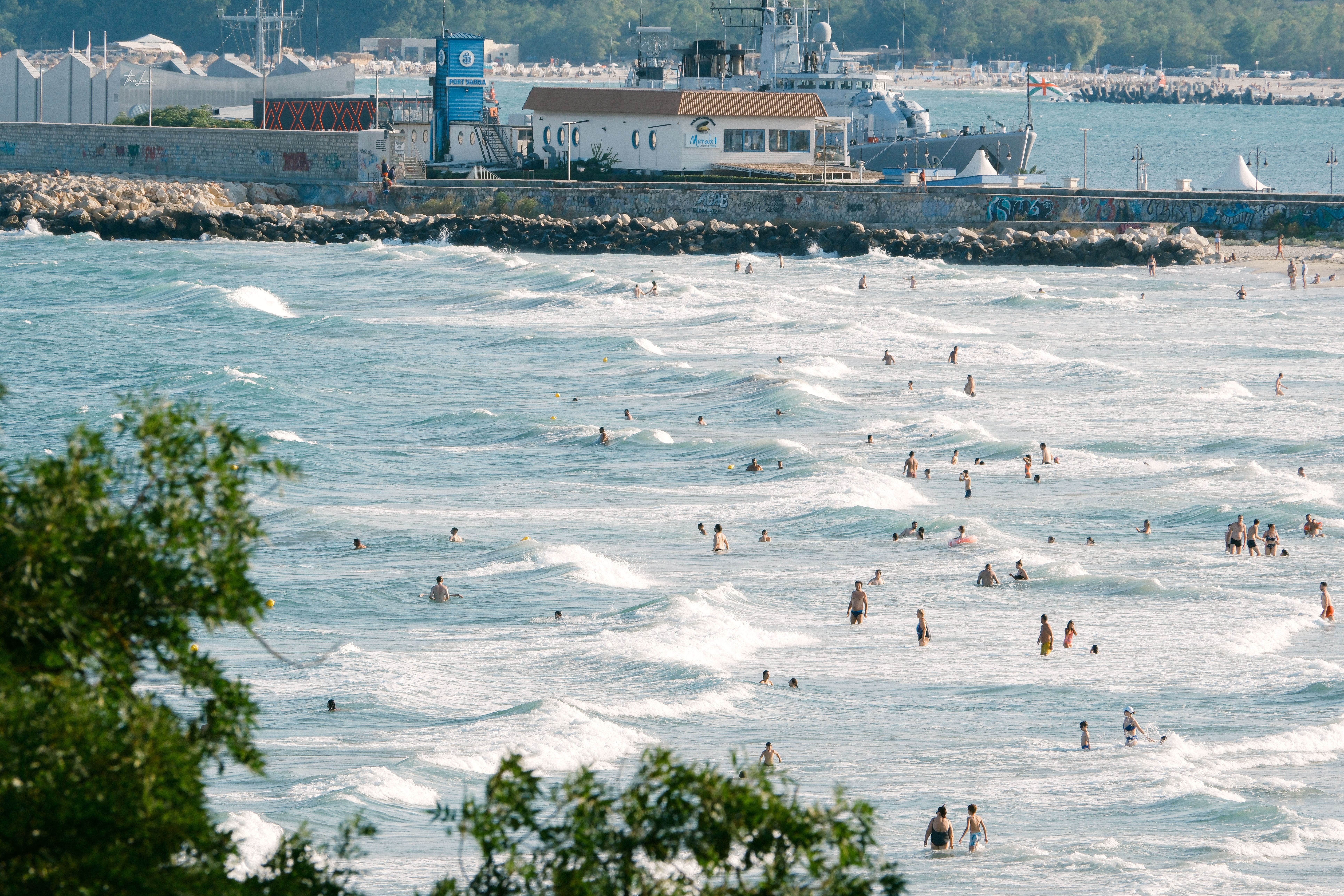 Light, breathable summer clothing and sunscreen on a beach along the Black Sea coast in Bulgaria.