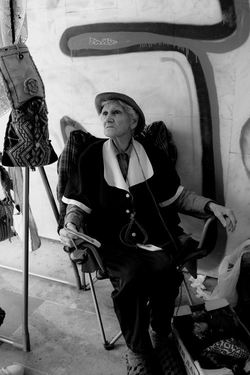 Free Black and white portrait of an elderly woman sitting outdoors in Bulgaristan. Stock Photo