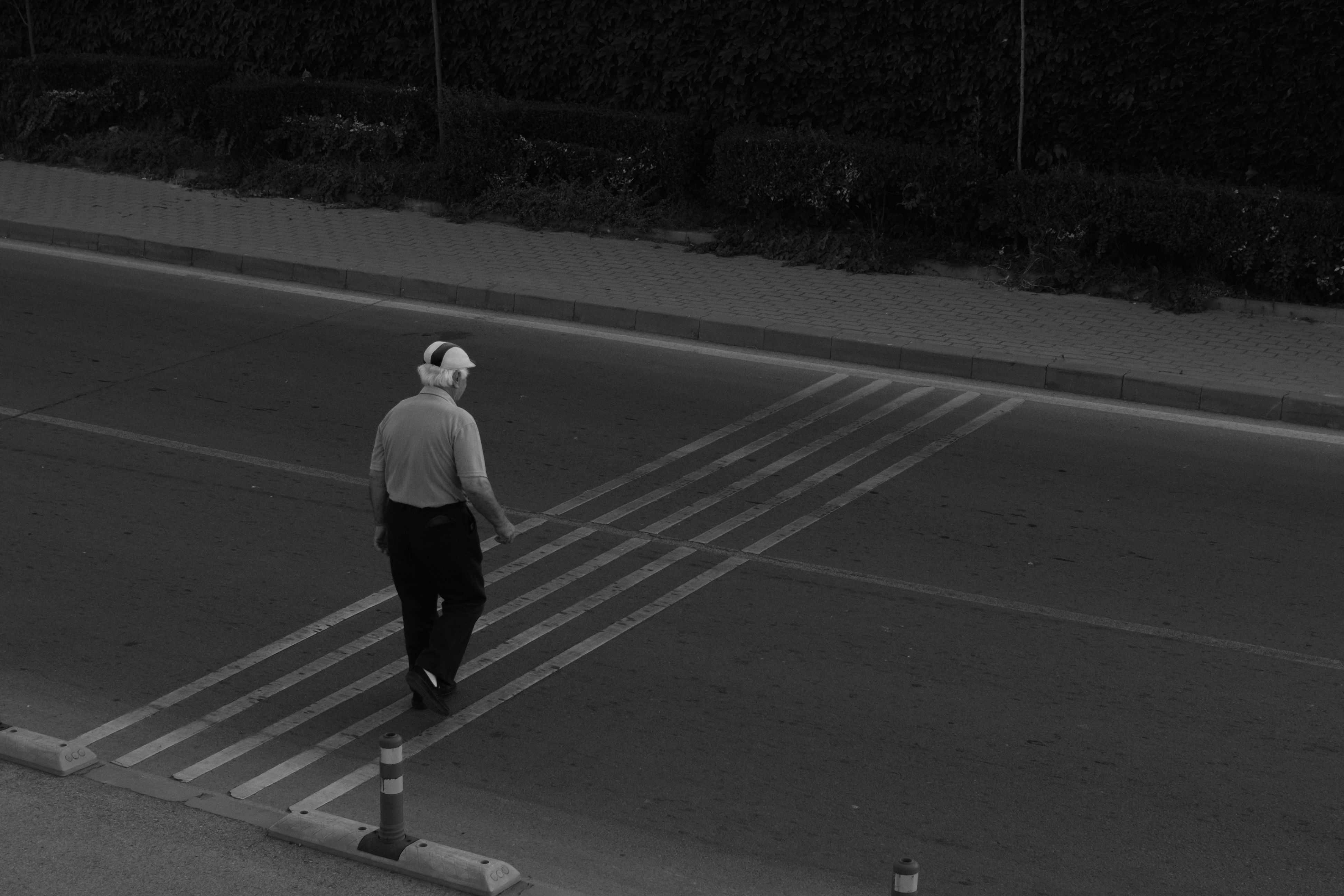 Pedestrians carefully crossing a street in Yerevan, Armenia, with local traffic