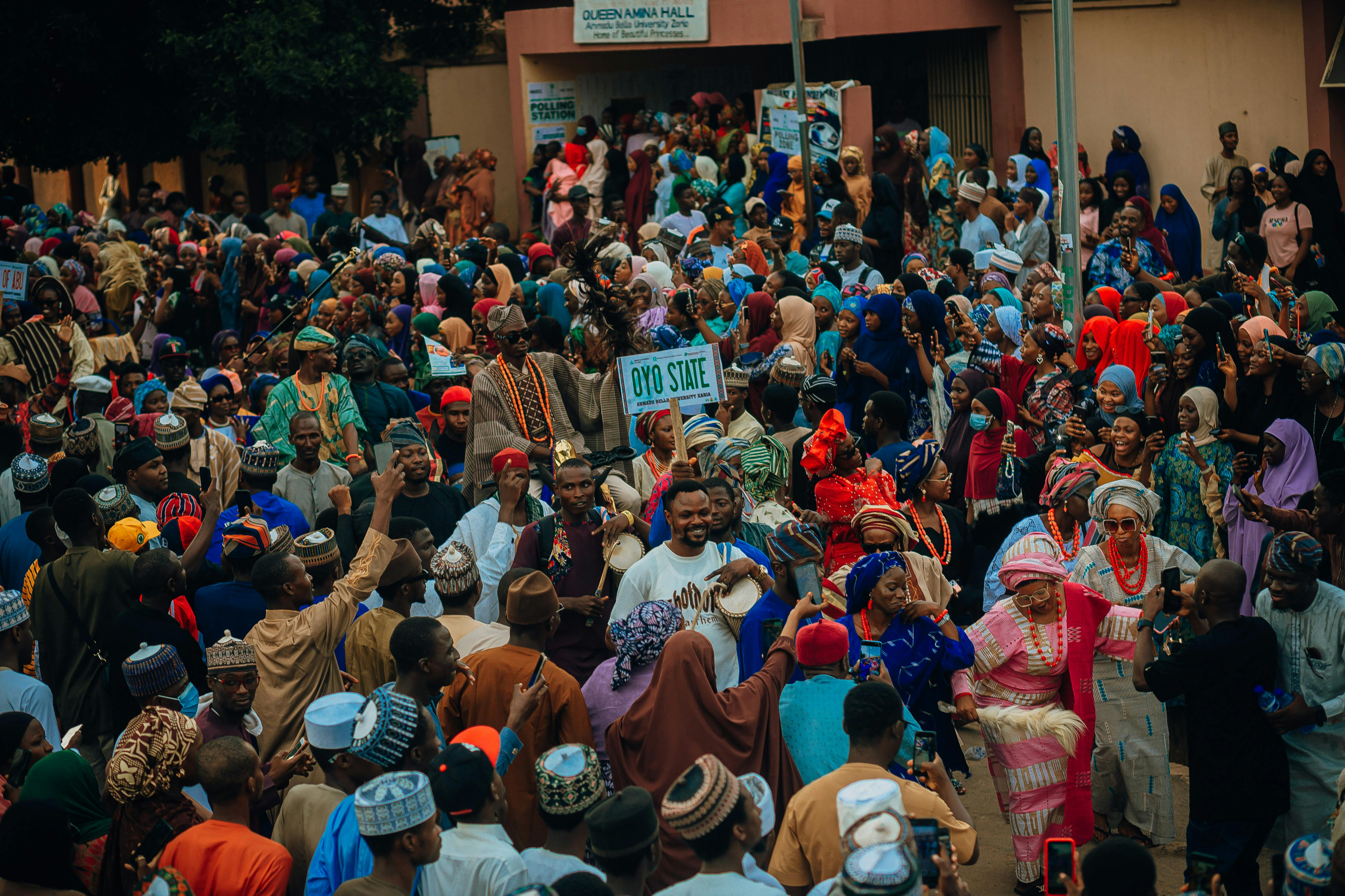Vibrant cultural festival crowd in Oyo State, Nigeria celebrating tradition.