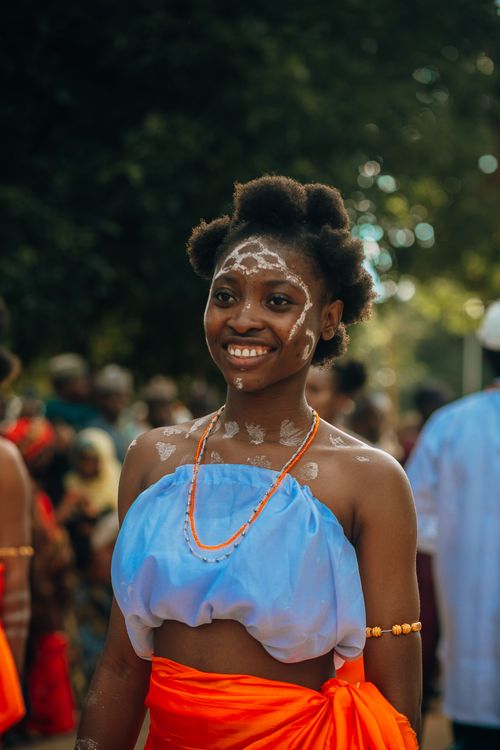 Smiling Woman in Traditional Festival Attire · Free Stock Photo
