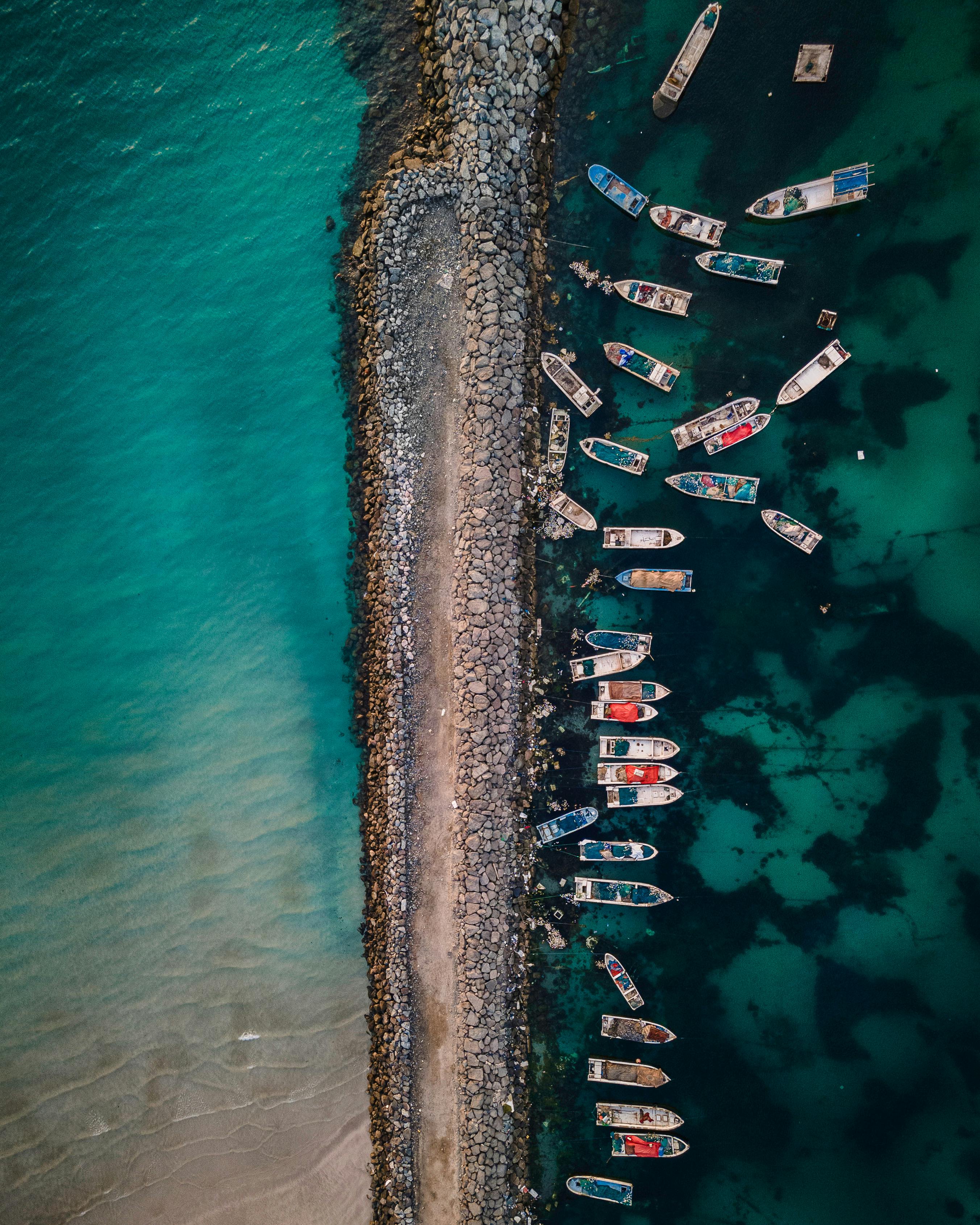 Aerial view of boats off Umm Al Quwain in the UAE, reflecting the Gulf commercial routes now under renewed security scrutiny.