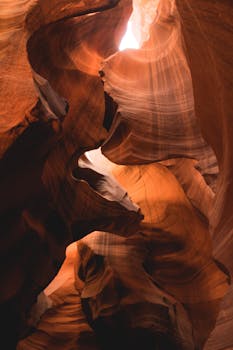 Stunning rock formations illuminated by sunlight in Antelope Canyon, Arizona.