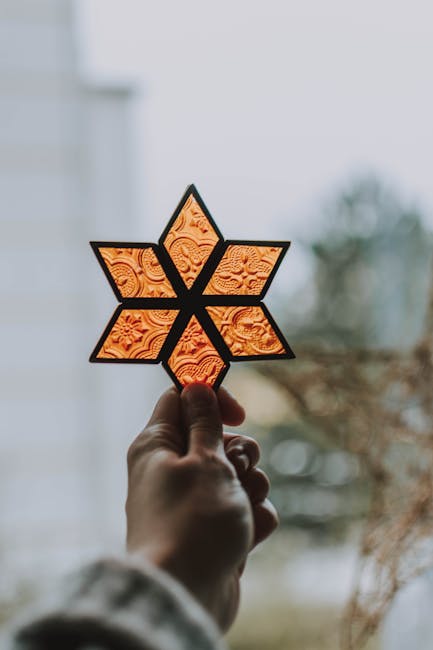 Person Holding Star Ornament