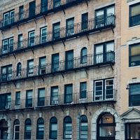 218 Pearl Row brick facade — photo by Teju on Pexels