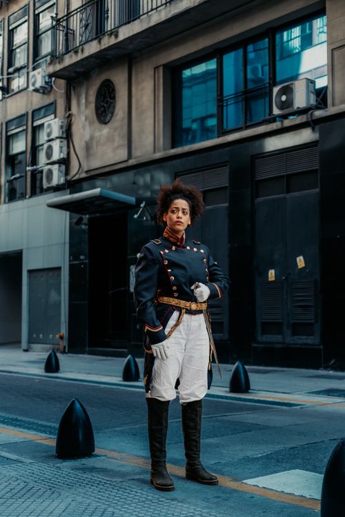 Free A person in vintage military attire stands confidently on a Buenos Aires street. Stock Photo