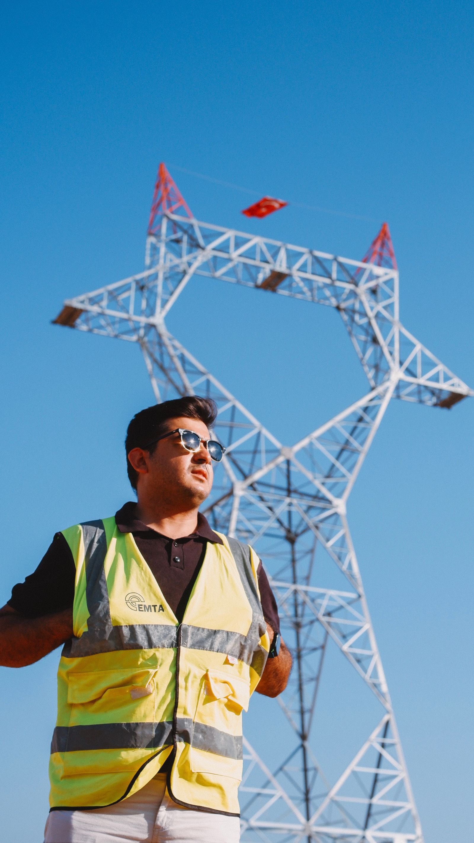 Engineer inspecting electrical transmission infrastructure