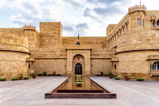 The stunning facade of Suryagarh Palace in Jaisalmer, displaying traditional Rajput architecture.