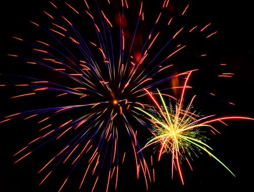 Free Vibrant fireworks bursting in the night sky, showcasing a colorful celebratory display. Stock Photo