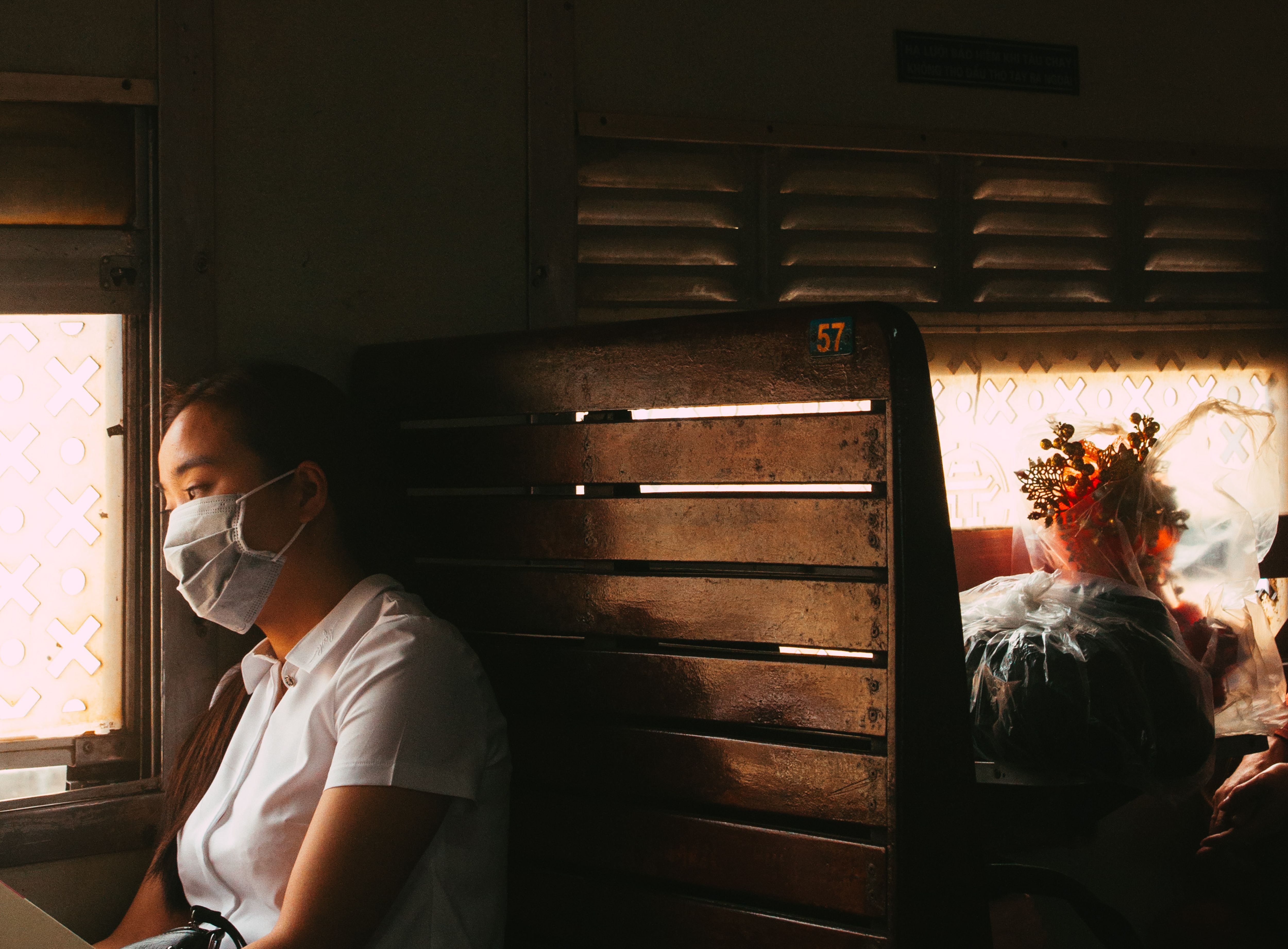 Young Woman with Mask on Train in Hanoi · Free Stock Photo