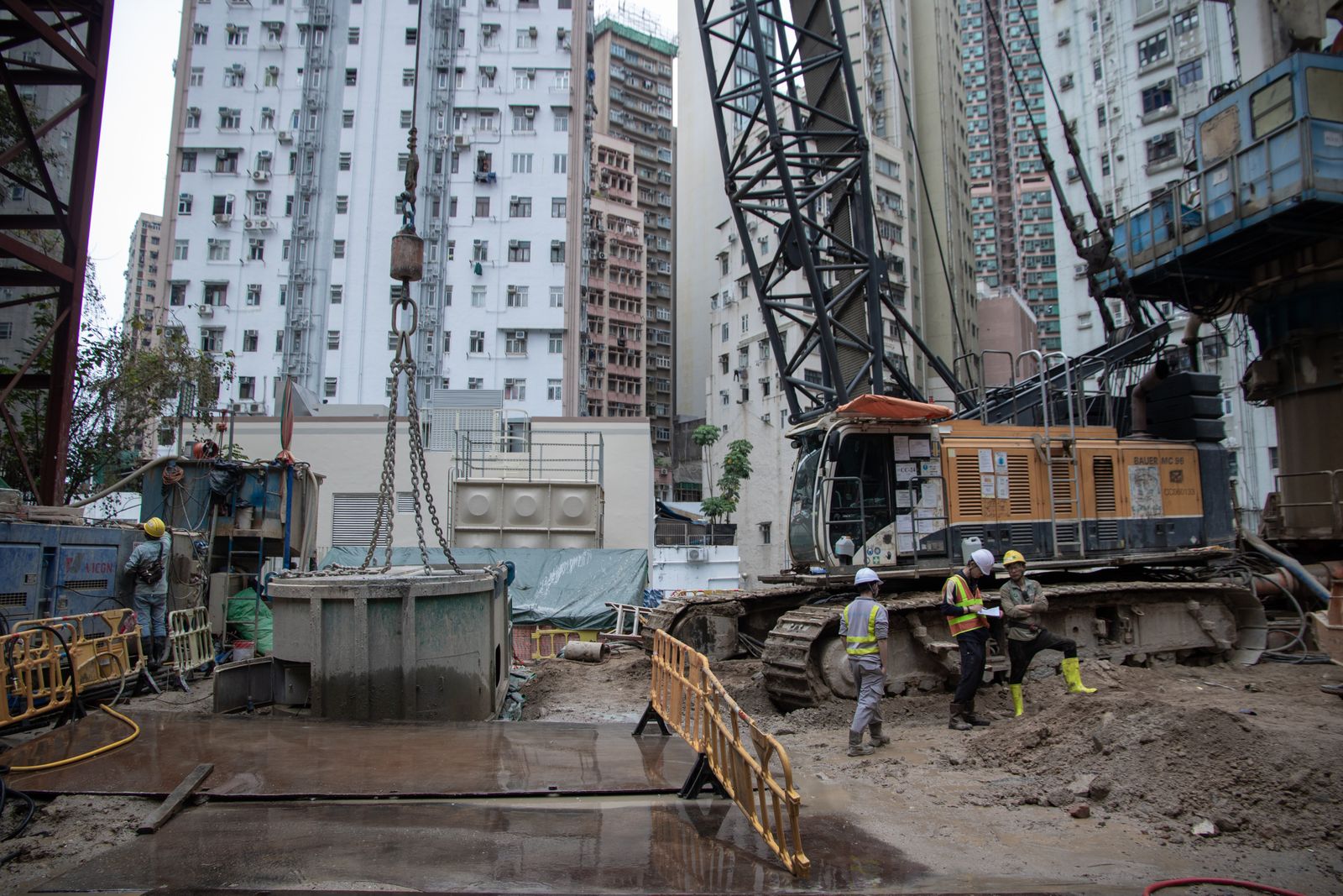 Construction site with cranes and active building works illustrating modular building-services package