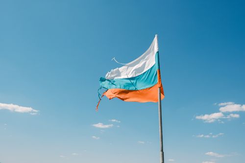 Free The Bulgarian national flag waving against a clear blue sky in Varna, Bulgaria. Stock Photo