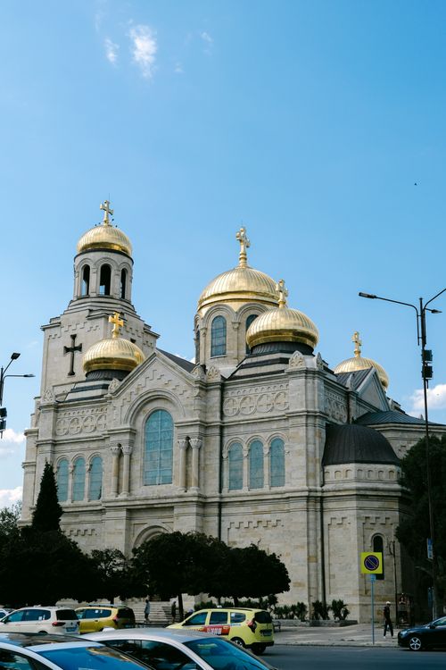 Free Stunning view of Varna's iconic Cathedral of the Assumption with its golden domes glowing under a clear blue sky. Stock Photo
