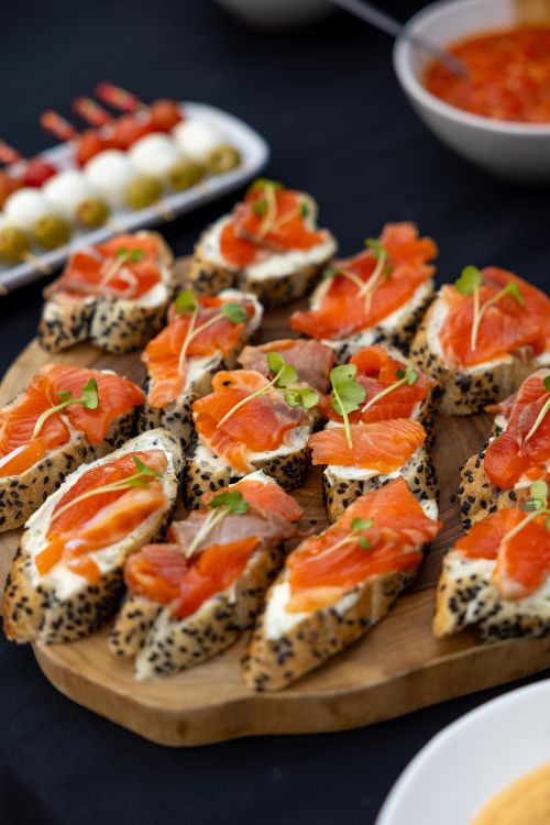 Free Delicious salmon canapés with sesame seed bread, perfect for gourmet catering events. Stock Photo