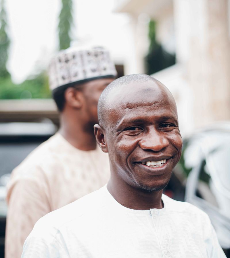 A smiling Nigerian man seller