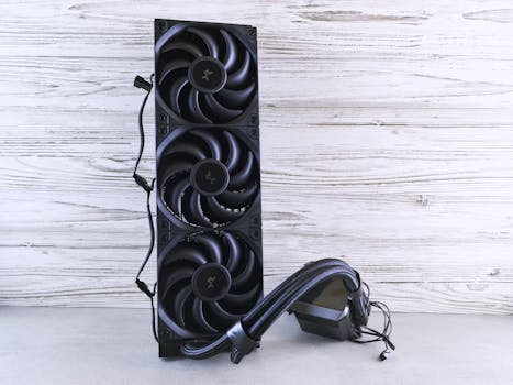 A triple fan radiator setup with cables, ideal for PC cooling solutions in a modern setting.