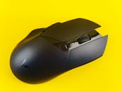 Sleek Black Gaming Mouse on Bright Yellow Background