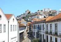 Whitewashed hillside street, photo by Carlos Fernando Caupers on Pexels