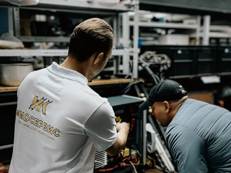 Technicians assembling computer hardware