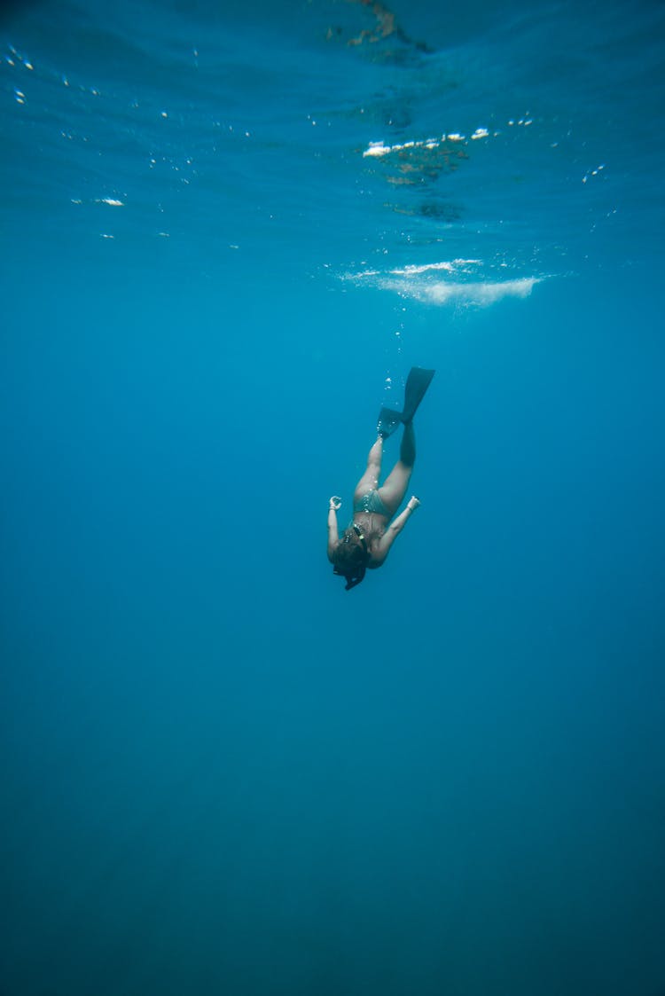 Photo Of Person Swimming Underwater