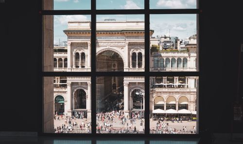 Free Scenic view of Galleria Vittorio Emanuele II from a window, capturing Milan's iconic architecture. Stock Photo