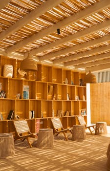 Wooden interior with natural light in a contemporary library, Ain Sokhna. Perfect for relaxation.