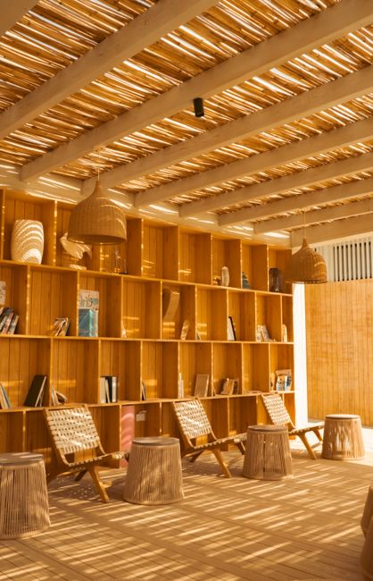 Wooden interior with natural light in a contemporary library, Ain Sokhna. Perfect for relaxation.