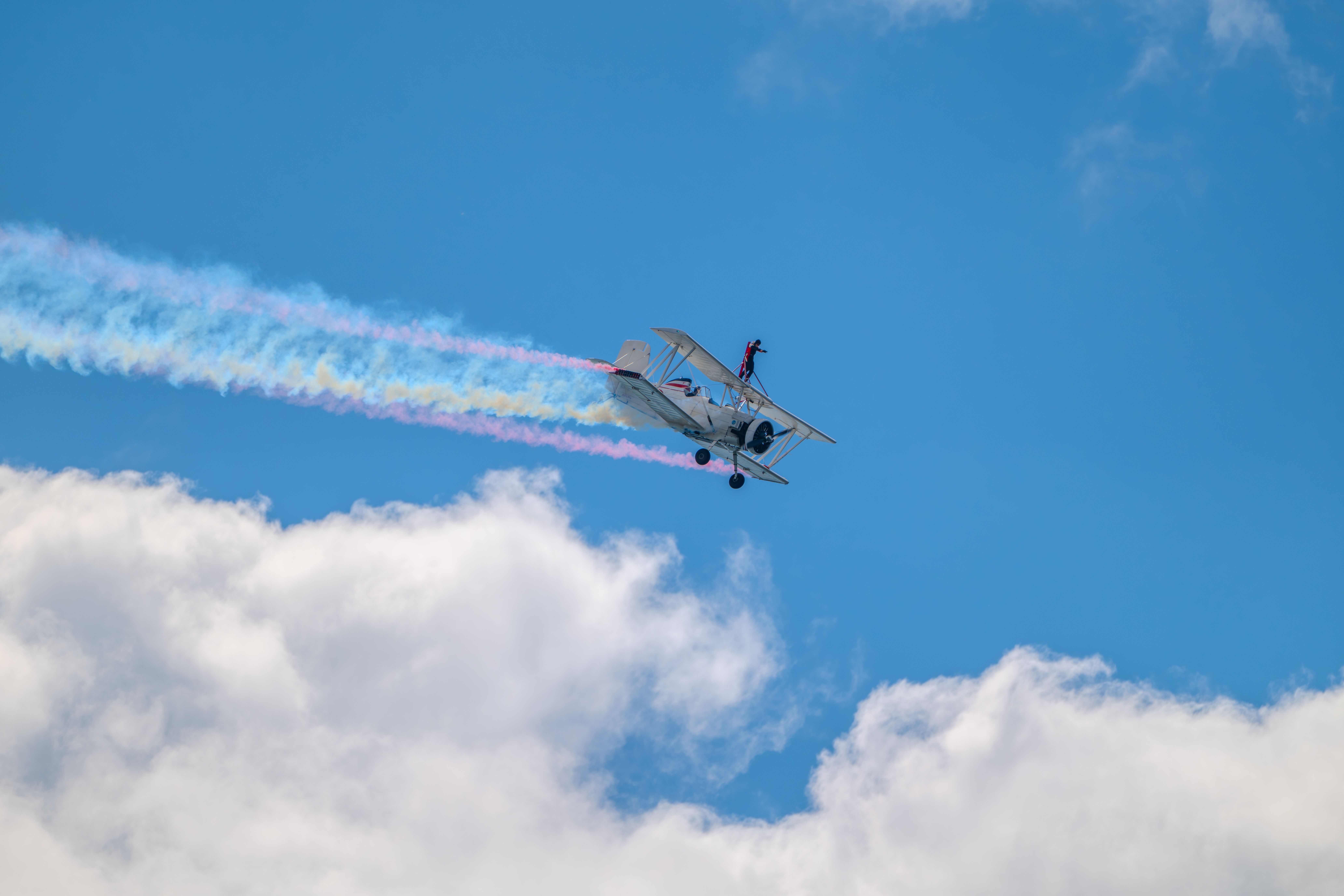 Biplane with Wingwalker Performing Aerobatics · Free Stock Photo