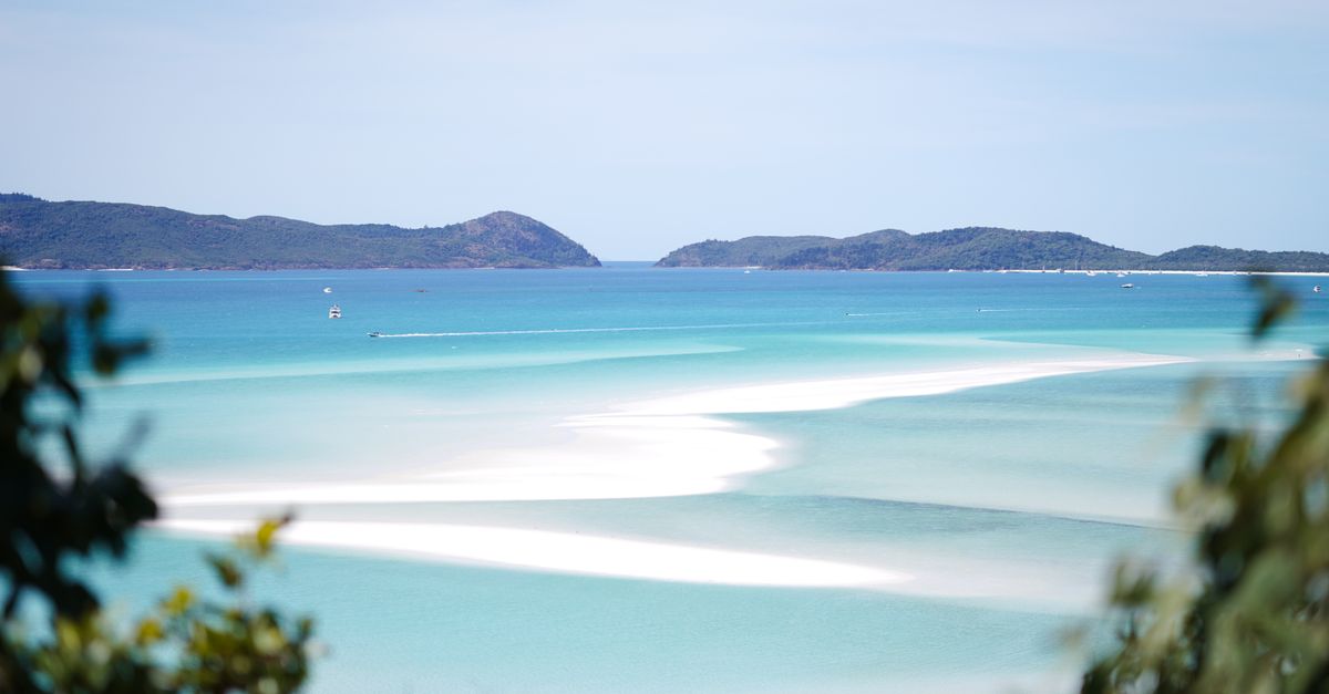 Breathtaking view of Whitehaven Beach's turquoise waters and pristine sands.