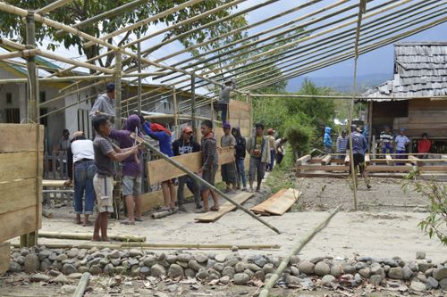 Free Local community working together on bamboo structure in South Sulawesi, Indonesia. Stock Photo