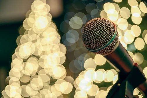 Bokeh Photography of Microphone With Lights