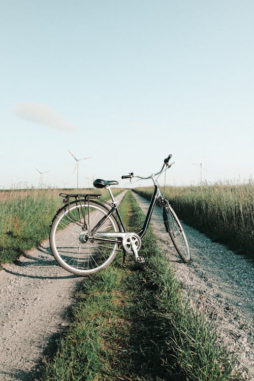 Photo Of Bicycle On The Middle Of Dirt Road 