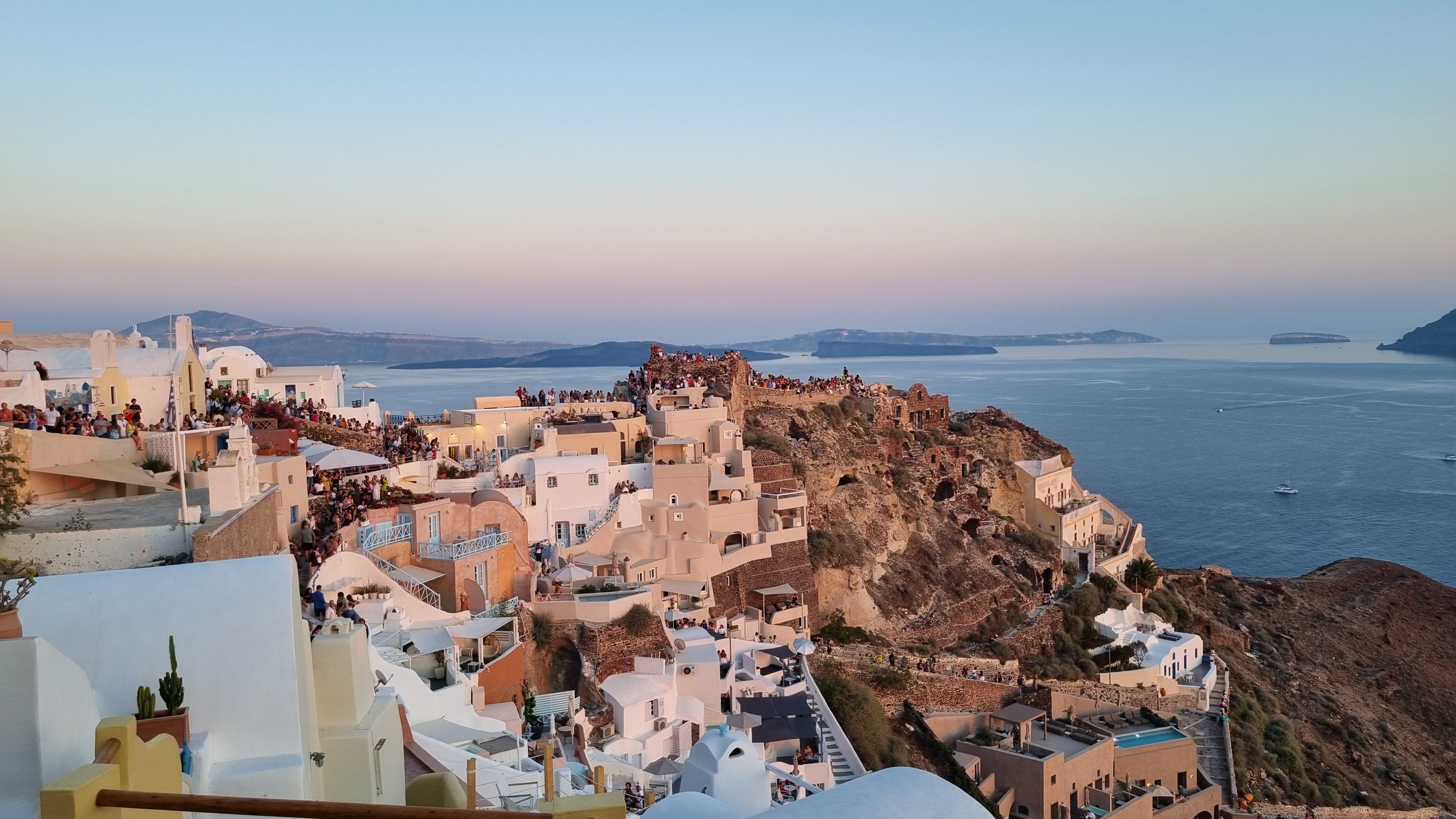 Oia Santorini crowded sunset viewpoint high season