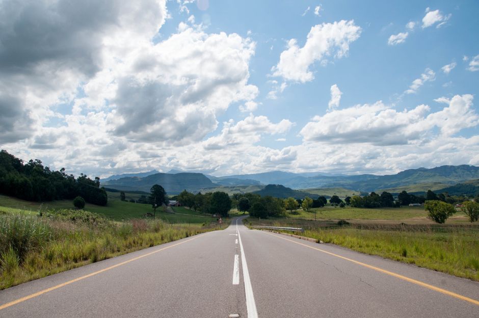Clear road signs on a major N-route highway in South Africa, indicating directions to key cities.