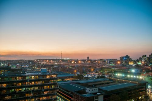 Free A stunning view of Johannesburg city skyline at twilight, highlighting urban lights and architecture. Stock Photo