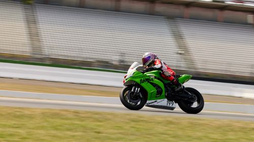 Free Professional motorcycle racer speeding at Hockenheimring in Germany. High-speed sports action captured outdoors. Stock Photo