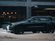 Black SUV parked on a city street, photo by Ricky Esquivel on Pexels