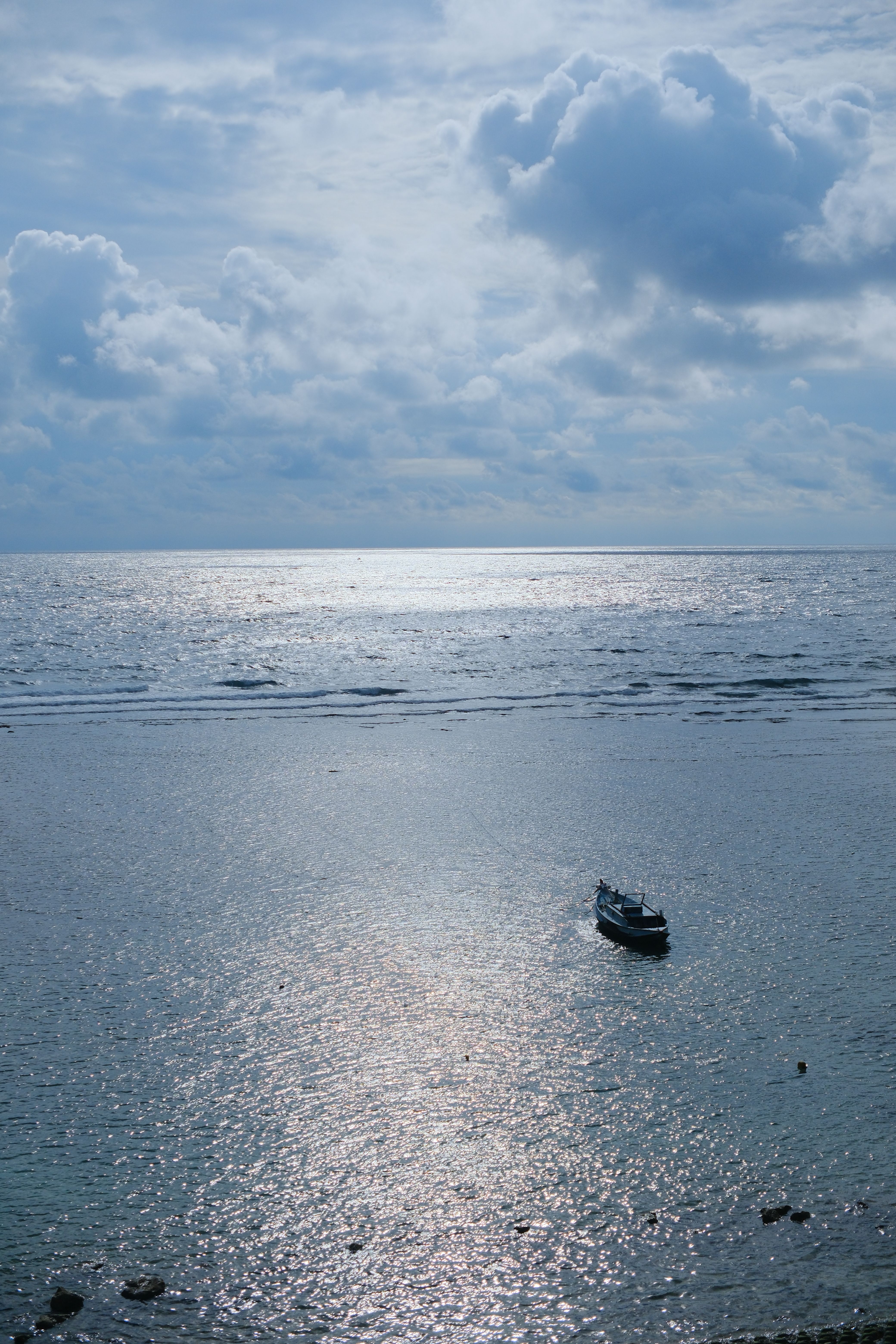 Tranquil Seascape with Boat at Sunset