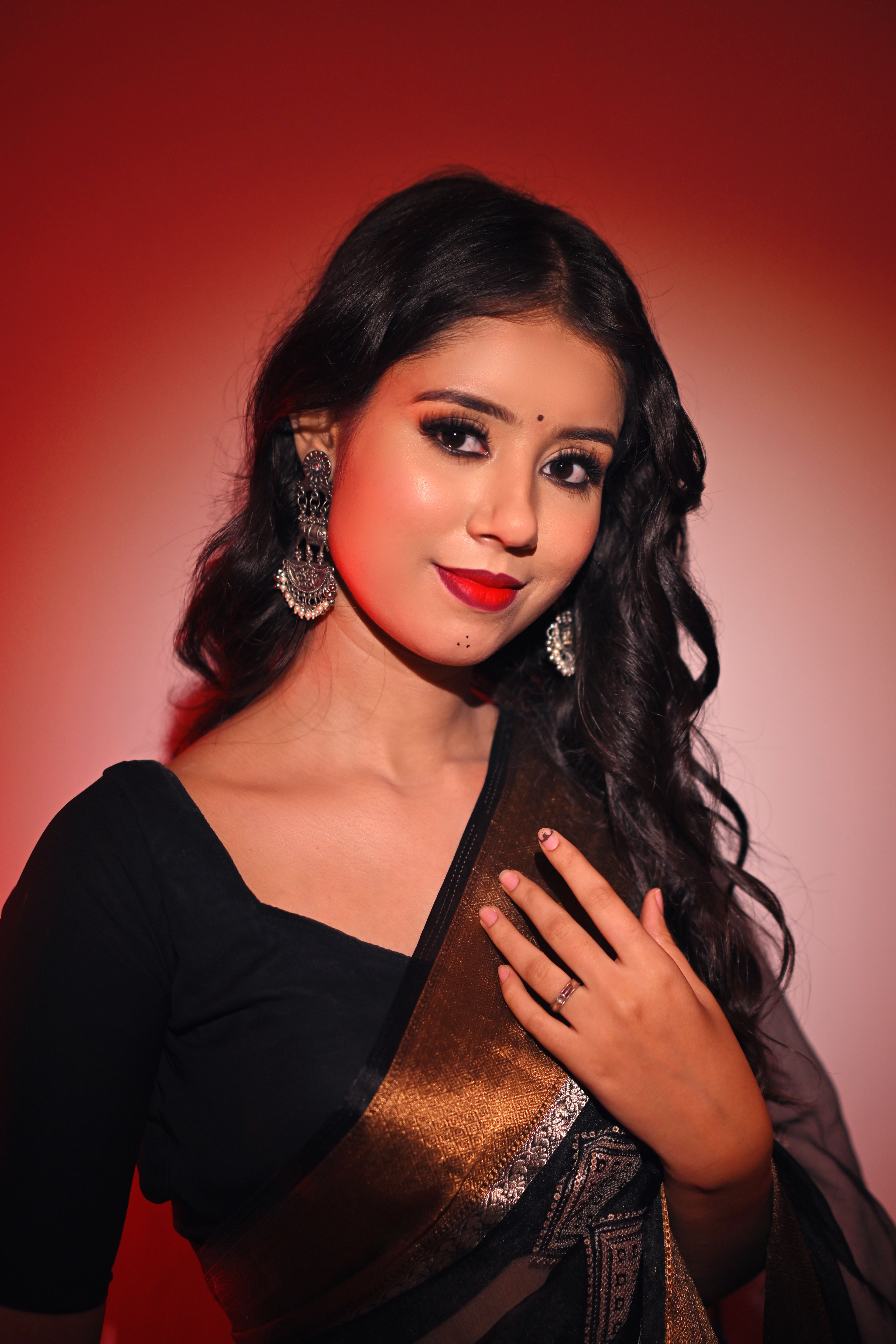 Elegant Woman in Traditional Indian Saree · Free Stock Photo
