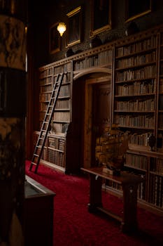 Explore the atmospheric Neo-Gothic library with rich wood and vintage decor in Scotland.
