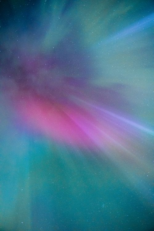 Free Stunning display of Northern Lights in Iceland with vibrant colors illuminating the night sky. Stock Photo