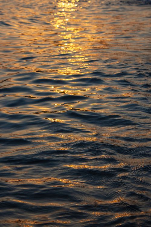 Free Serene golden sunset reflection on the ocean waves in Anamur, Mersin, Türkiye, creating a tranquil atmosphere. Stock Photo