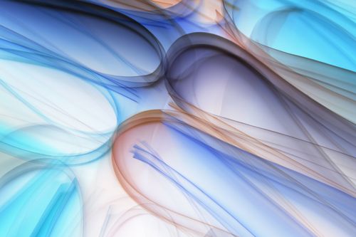 Free Vibrant abstract design featuring flowing lines in blue, purple, and orange tones. Stock Photo