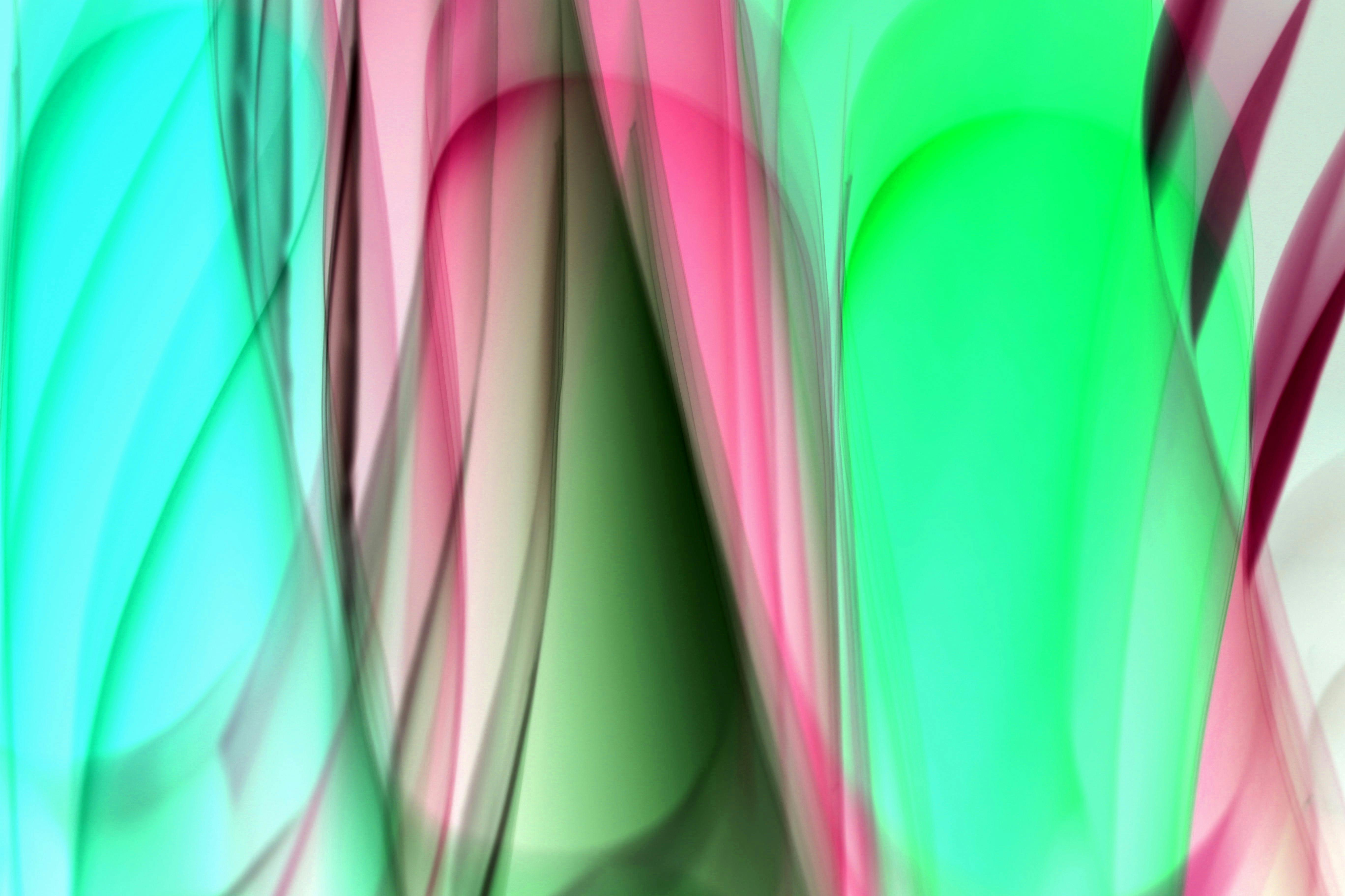 Free Colorful abstract light painting featuring vivid green and pink hues, ideal for modern art backgrounds. Stock Photo