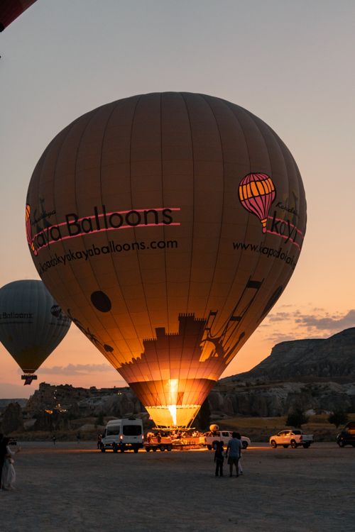 Free Hot air balloons preparing for flight at sunset in Cappadocia, Turkey. Stock Photo