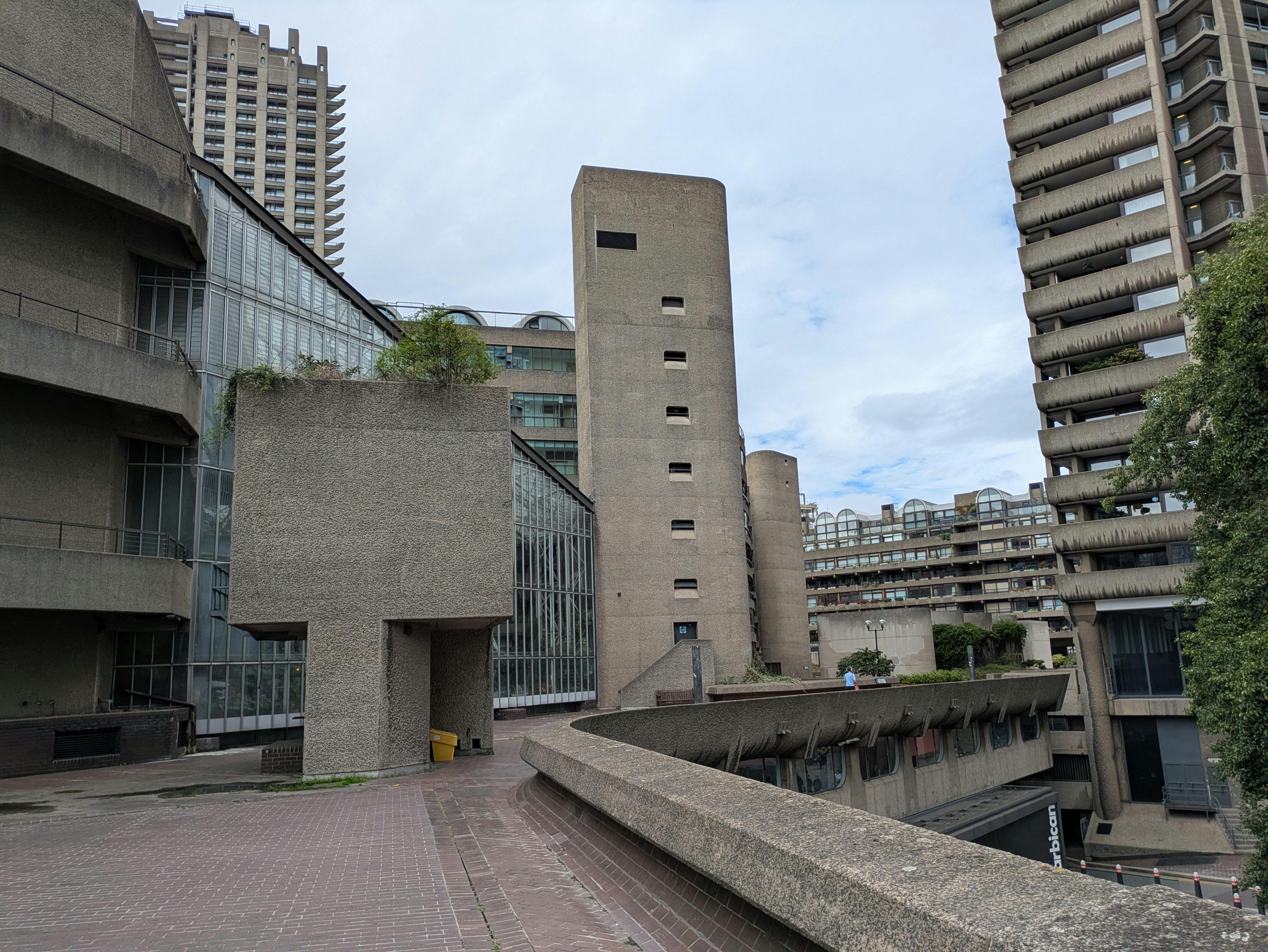 Concrete architecture of the Barbican Centre in London showcasing Brutalist design.