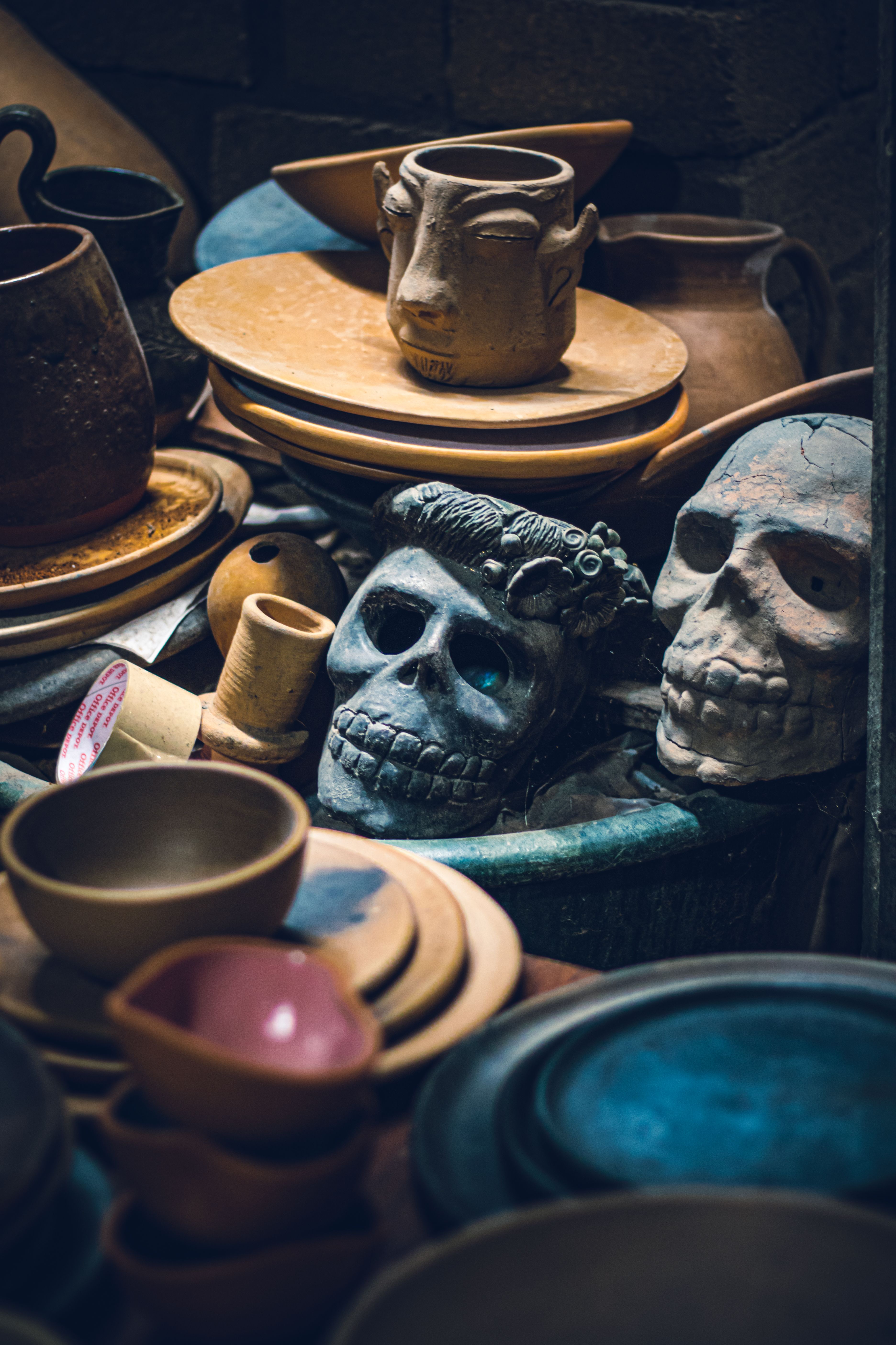Hand-painted ceramic skulls and pottery for sale at a market in Oaxaca, Mexico